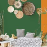 Modern minimal home interior design. Pillows, golden teapot, decorative straw plates, Scandinavian blanket, tropical palm tree, succulent and decorations.